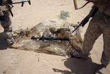 STK101808M
Marines stand over a rocket-propelled grenade launcher.