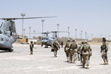 STK101859M
Marines approach two CH-46E helicopters to catch a ride into the battlefield.