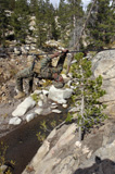 STK101916M
A Marine works his way across a one-rope bridge spanning a small gorge.