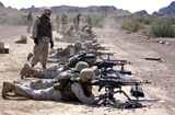 STK101964M
Marines fire their M240G medium machine guns and M249 squad automatic weapons.