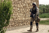 STK101986M
A Squad Automatic Weapon machine gunner on patrol.