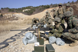 STK102005M
A field wireman fires an M2 .50 caliber heavy machine gun.