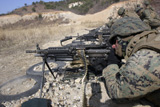 STK102007M
A corpsman fires an M249 Squad Automatic Weapon.