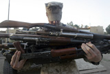 STK102030M
A marine readies 80 pounds of enemy rifles seized.