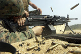STK102044M
A Marine engages targets with an M-249 Squad Automatic Weapon.