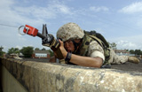STK102080M
A Marine drinks from his CamelBak while he scans his position for enemy activity.