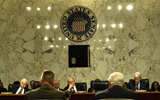 STK102105M
The Department of Defense address questions in a hearing.