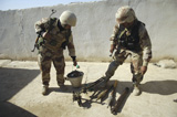 STK102272M
Iraqi army soldiers find a weapons cache.