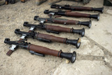STK102291M
U.S. Marines make an inventory of weapons found on a cache site.