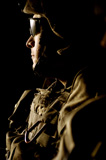 STK102321M
U.S. Army soldier scans his sector aboard a UH-60 Black Hawk helicopter.