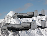 STK102358M
A-10 Thunderbolt II's fly over mountainous landscape.