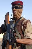 STK102422M
An armed Iraqi Army guard provides security.