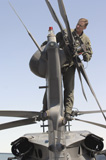 STK102444M
Sergeant inspects an HH-60 Pave Hawk rotor tail assembly.