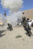 STK102579M
Soldiers react to a simulated improvised explosive device detonation.