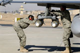 STK102655M
Airmen inspect F-16 Fighting Falcon munitions prior to take off.