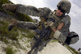 STK102730M
A soldier carries a wounded soldier to safety.