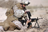 STK102824M
Marine gives instructions on how to perform remedial action on the squad automatic weapon.