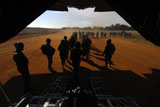 STK102839M
Soldiers board a C-130 Hercules during Operation Toy Drop.