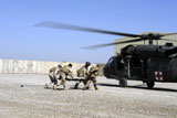 STK102890M
Soldiers rush a simulated casualty to a UH-60 Blackhawk helicopter.