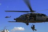STK102916M
U.S. Air Force Pararescuemen are hoisted into an HH-60 Pavehawk helicopter.