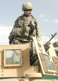 STK103037M
Airman prepares for a patrol and to man an M249 automatic rifle.
