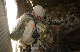 STK103066M
A U.S. Army soldier entering a weapons cache site in Jalalabad, Afghanistan.