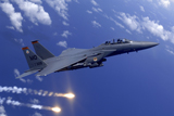 STK103083M
An Air Force F-15E Strike Eagle fires flares during an aerial training dog fight off the coast of Guam.