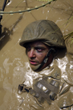 STK103264M
U.S. Marine advancing through an obstacle course at the Jungle Warfare Training Center in Okinawa, Japan.