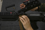 STK103299M
An M-249 Squad Automatic Weapons is loaded with 5.56mm rounds.