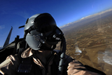 STK103383M
U.S. Air Force Aerial Combat Photographer watches for threats to a F-15E Strike Eagle.