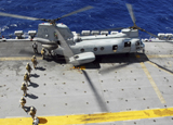 STK103639M
Marines board a CH-46E Sea Knight helicopter on the flight deck of USS Peleliu.
