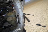 STK103669M
An aerial gunner scans terrain for training targets from an HH-60 Pave Hawk.