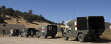 STK103800M
U.S. Army ambulance units participate in a simulated evacuation scenario.