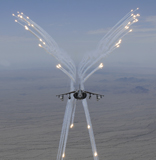 STK103834M
An AV-8B Harrier fires flares during a training flight.