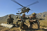 STK103914M
n HH-60G Pave Hawk hovers over pararescuemen.