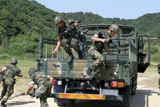 STK103951M
Republic of Korea Marines dismount their vehicle.