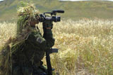 STK104078M
A combat videographer practices evasion techniques.