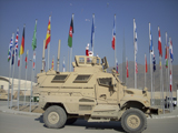 STK104170M
Santa tosses candy from a MaxxPro Mine Resistant Ambush Protected vehicle.
