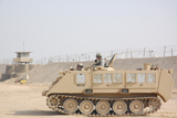 STK104211M
Soldiers patrol in an M-113 Armored Personnel Carrier.