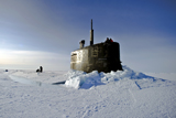 STK104261M
Submarine USS Connecticut surfaces above the ice.