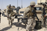 STK104280M
Marines carry a wounded comrade.