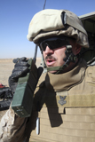 STK104291M
An officer relays commands on his walkie talkie.