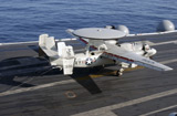 STK104470M
An E-2C Hawkeye makes a successful arrested landing aboard USS Kitty Hawk.