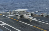 STK104476M
An E-2C Hawkeye is recovered during flight deck operations aboard USS Theodore Roosevelt.