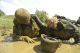 STK104525M
Midshipmen maneuver through a mud pit as part of Sea Trials.