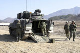 STK104528M
U.S. Soldiers prepare an M2 Bradley Fighting Vehicle.