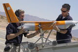 STK104541M
Engineers mount a ScanEagle unmanned aerial vehicle on a catapult launcher.
