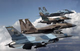 STK104567M
A flight of Aggressor F-15 and F-16 aircraft fly in formation.