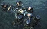STK104571M
Students secure a simulated casualty to a spine board during a training scenario.