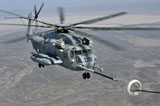STK104583M
A CH-53E Super Stallion approaches a C-130P aircraft to refuel.